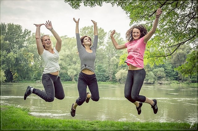 health benefits of peaches: women jumping in the air