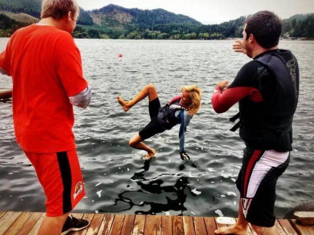 Photo taken at just the right time, girl just before she falls back-first into water