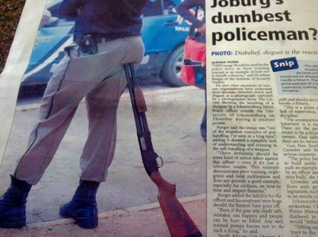 funny pictures of bad ideas, policer officer sitting on his rifle