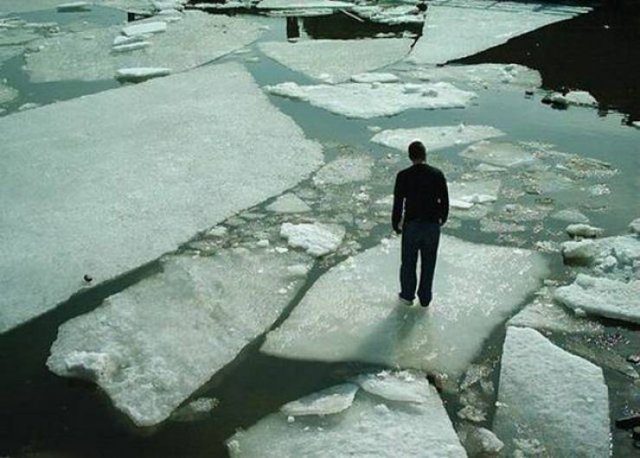 funny pictures of bad ideas, man standing in the middle of many icebergs