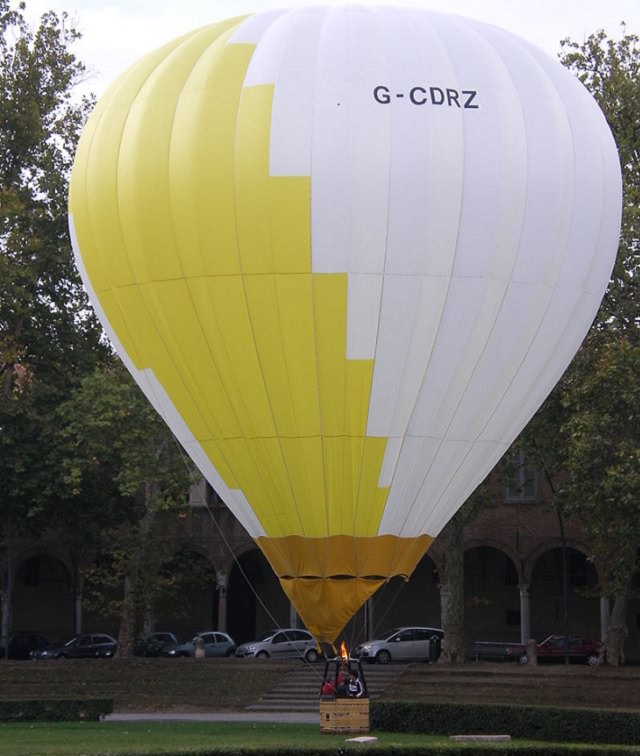 Different Hot air Balloons from Around the World, Balloon of the Ferrara Balloons Festival, white and yellow hot air balloon