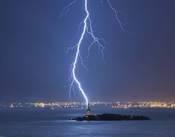 Perfectly-Timed Photos, lightning striking the torch and top of the statue of liberty