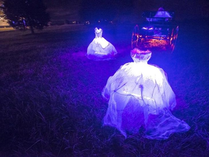 Most Incredible Halloween Decorations, headless glowing women ghosts in large white dresses