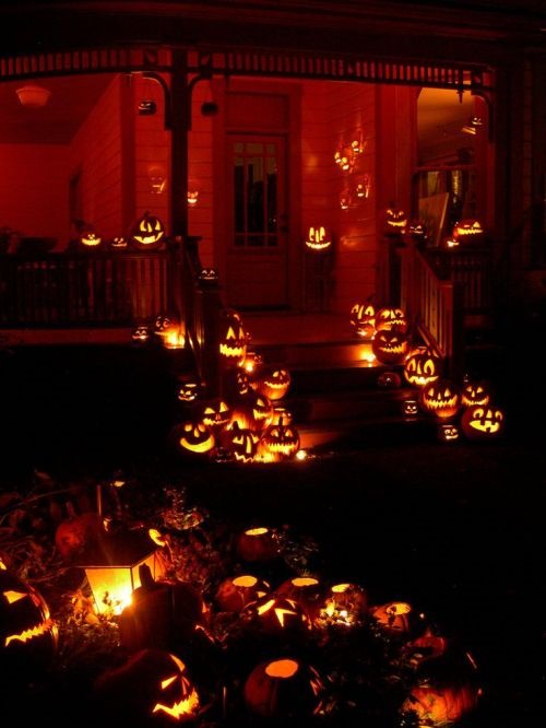 Most Incredible Halloween Decorations, a large group of jack o lanterns lit up at night
