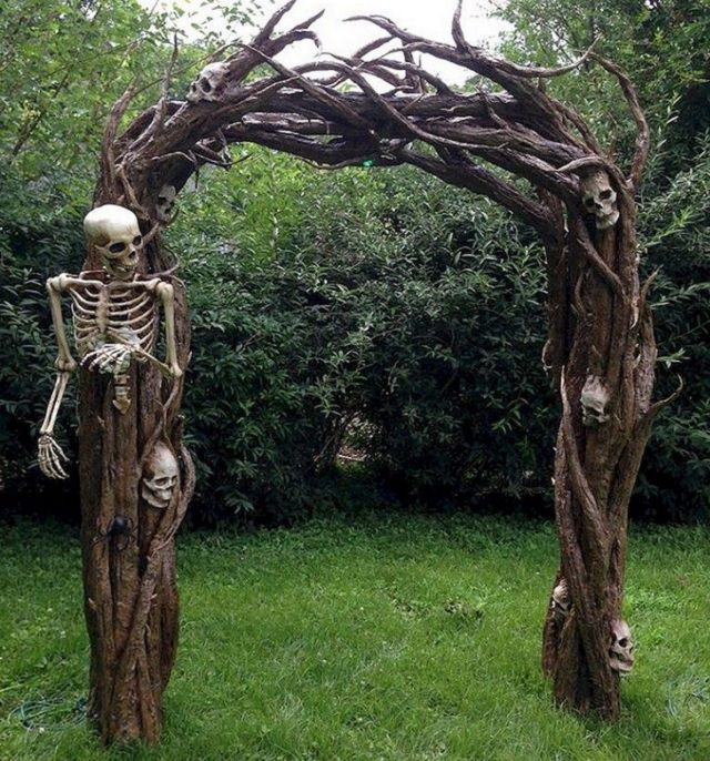 Most Incredible Halloween Decorations, Archway made of wood with skeletons embedded into it