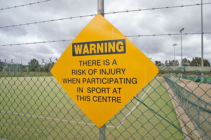Funny warning and caution signs, caution sign stating that injuries may occur in this sports center
