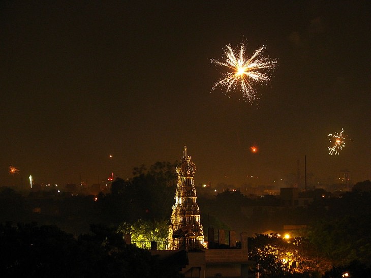 Photos from Diwali, the festival of lights, Fireworks over a temple, as seen by a rooftop in Chennai, India