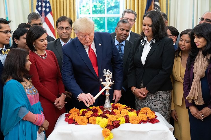 Photos from Diwali, the festival of lights, President Donald Trump Participating in the ceremonial lighting of the diya for Diwali