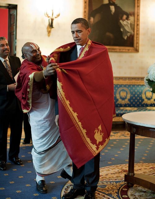 Photos from Diwali, the festival of lights, President Barack Obama recieving a Red Shawl from a Hindu Priest for Diwali, in the Blue Room of the White House