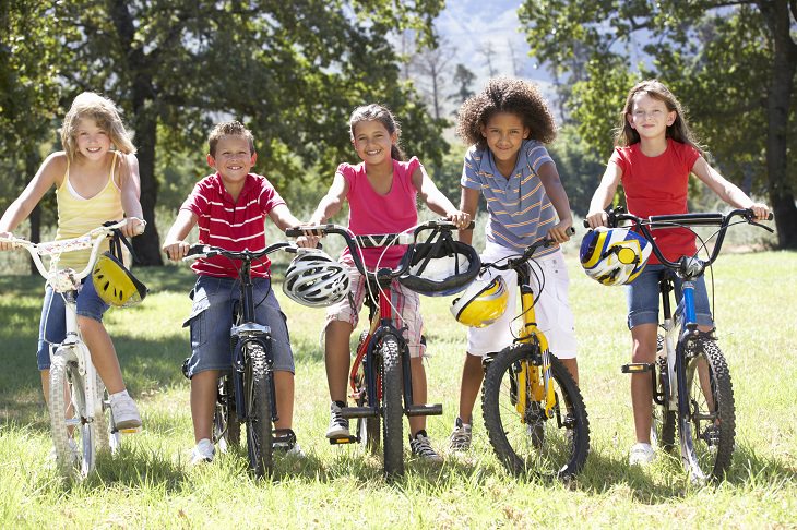 the dutch reach method of opening car doors for safety, group of children on their bicycles