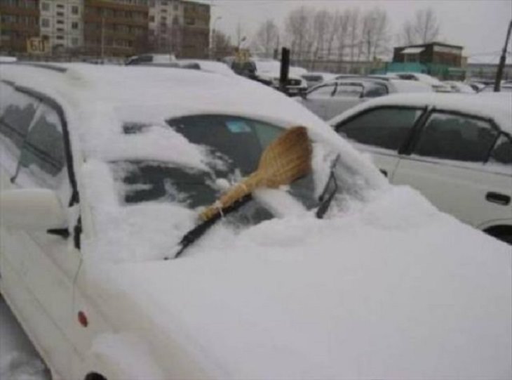 Hilarious but Smart Life Hacks, car with a large wooden spatula tied to the windshield wipers to wipe off snow