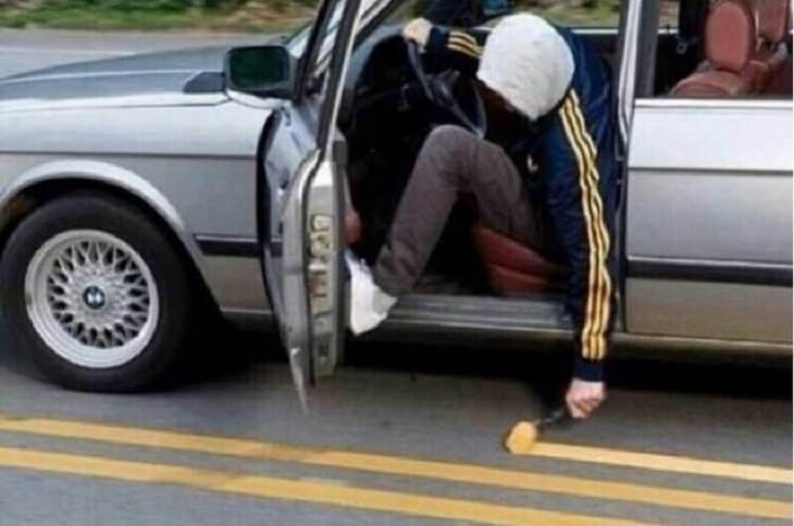 Hilarious but Smart Life Hacks, man painting yellow lines on the road while driving in his car with the door open