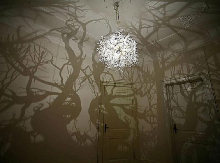 Incredible Innovative Design Ideas, circular chandelier with numerous vines giving the shadow of a forest