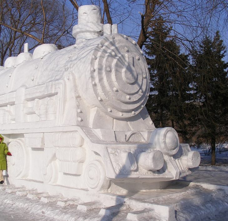 Snow Sculptures and Statues from Festival, A steam train made of snow at the Snow World exhibition on Sun Island in Harbin, China