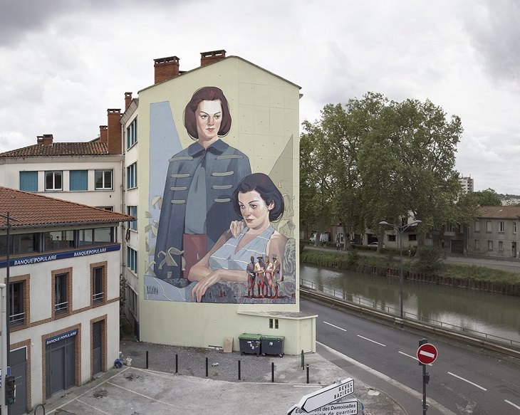 Beautiful Street art and graffiti murals from around the world, Aryz's mural in France (2016), young woman with short red hair standing next to a young woman with short black hair sitting in a chair