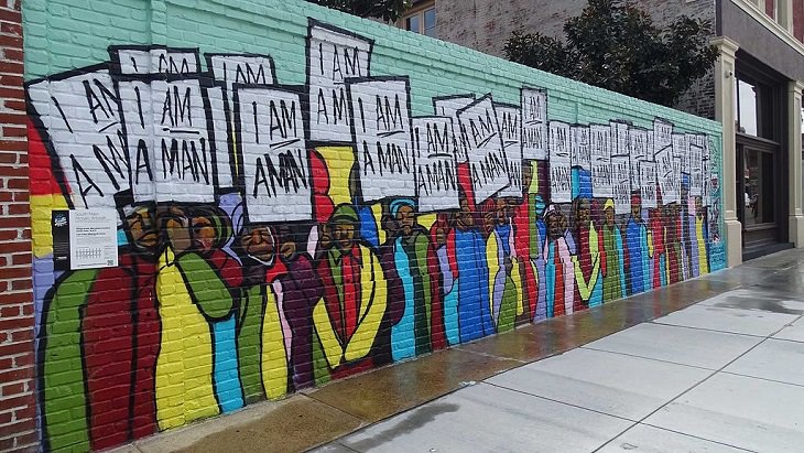 Beautiful Street art and graffiti murals from around the world, Wall mural of a group of men in different colored shirts holding signs that say "I Am A Man", in Memphis Tennessee