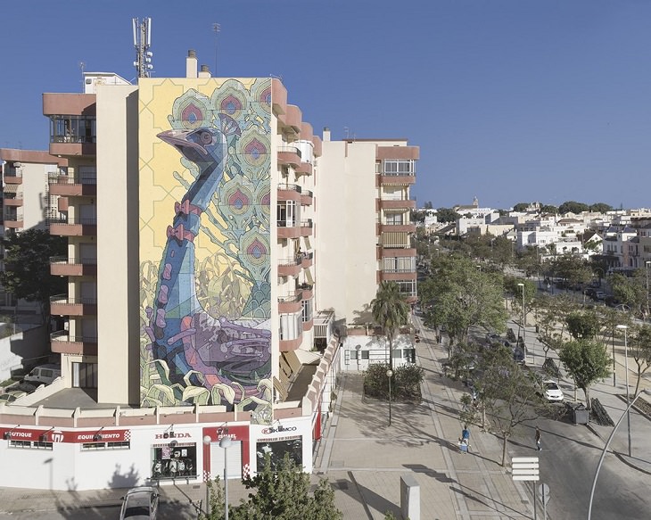 Beautiful Street art and graffiti murals from around the world, Aryz's mural of a peacock in Sanlucar de Barrameda (2013)