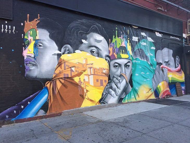 Beautiful Street art and graffiti murals from around the world, Chelsea street art in Manhattan that depicts 5 people with multi-colored adornments painted on their face
