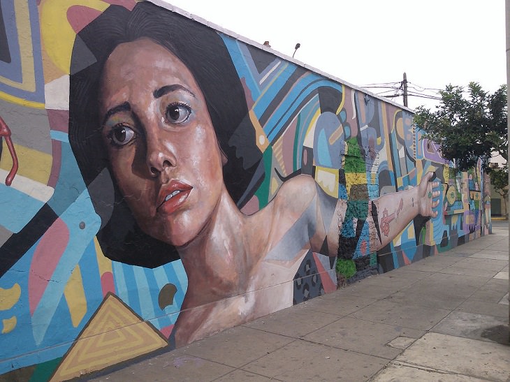 Beautiful Street art and graffiti murals from around the world, Mural of a brunette short-haired woman and numerous shapes painted in Hipolito Unanue Street, Miraflores, Lima, Peru