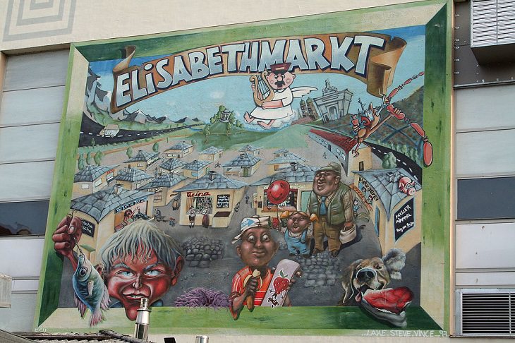 Beautiful Street art and graffiti murals from around the world, mural painted of a cartoon version of Elisabeth Market in Munich