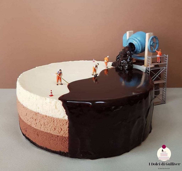 Beautiful Cakes Designed by Italian Chef, Tri-colored cake with one half covered in chocolate icing that looks like it's being poured from a tar machine and mopped across by small figurines