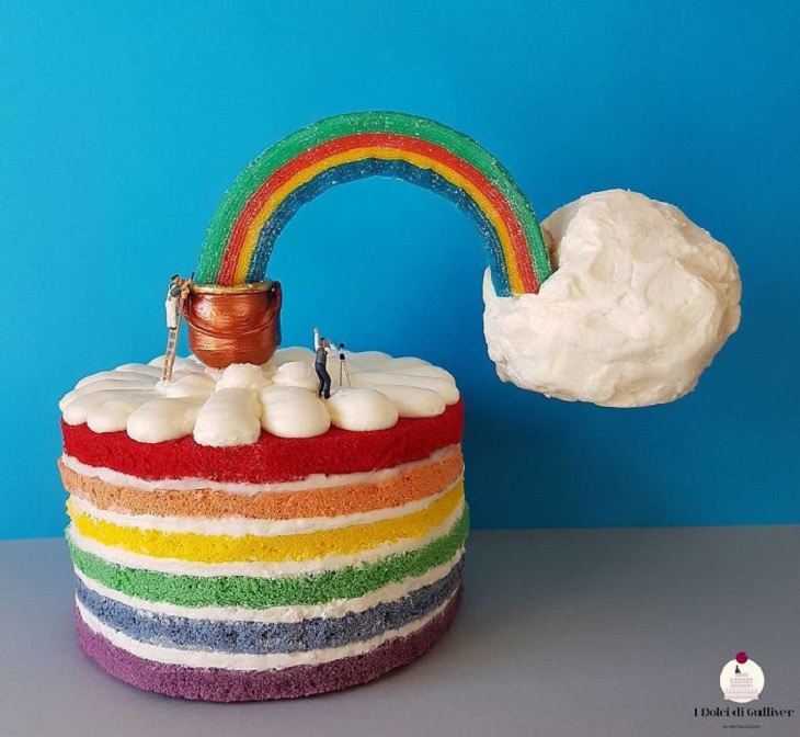 Beautiful Cakes Designed by Italian Chef, Rainbow cake with vanilla icing and rainbow on top leading to white puffy cloud
