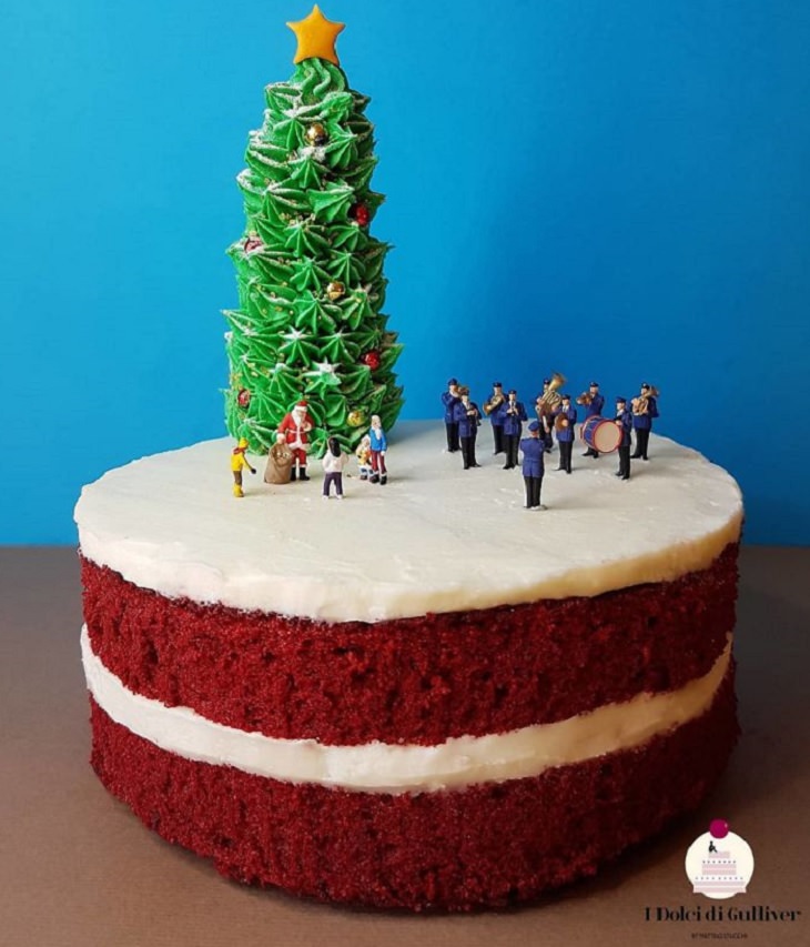 Beautiful Cakes Designed by Italian Chef,  Red velvet cake with Christmas tree on top made of icing and miniature figurines celebrating around and a miniature matching band