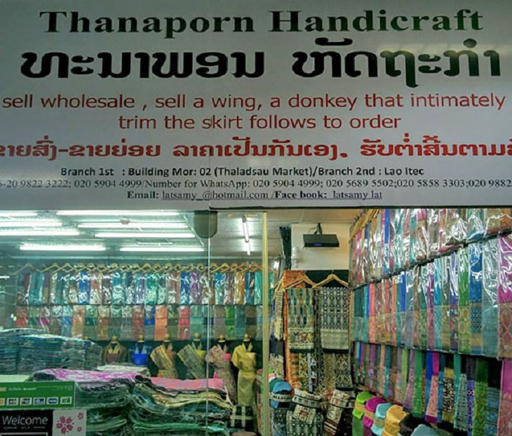 Funny foreign language signs, translations fails, handicraft shop sign with the words sell wholesale, sell a wing, a donkey that intimately trim the skirt follows to order