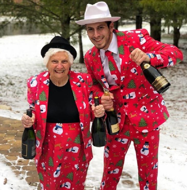duo of grandmother and grandson, ross smith, wear fun costumes for social media, in red christmas themed outfits