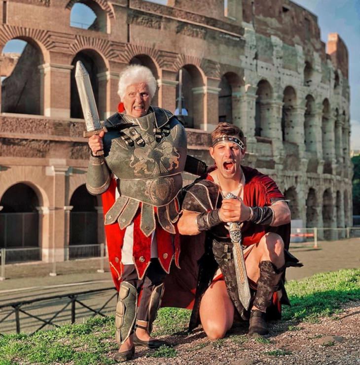 duo of grandmother and grandson, ross smith, wear fun costumes for social media, dressed as gladiators in front of the colloseum