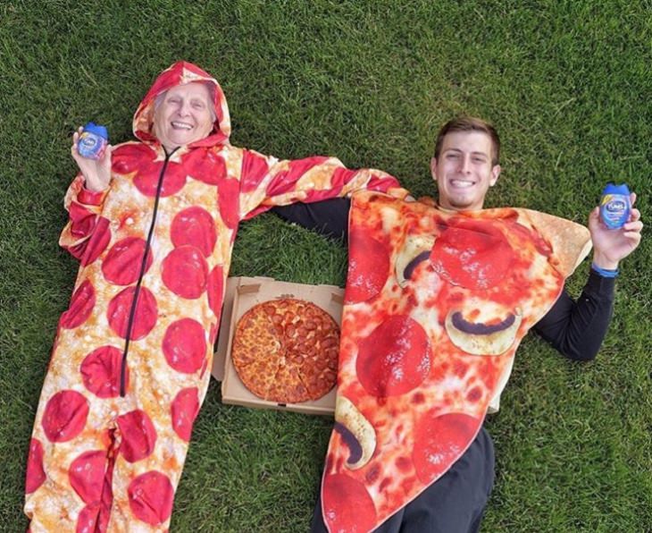 duo of grandmother and grandson, ross smith, wear fun costumes for social media, dressed as pepperoni pizza slices
