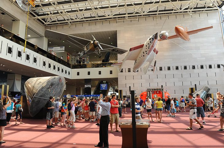 Historical treasures and incredible exhibits in the National Air and Space Museum in the National Mall of Washington DC, Milestones of Flight entrance hall, with Spirit of St. Louis, the Apollo 11 command module, SpaceShipOne, the Bell X-1, and (far right) the Friendship 7 capsule. 