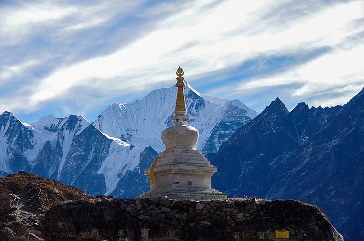 Pictures of the tallest peaks and beautiful landscapes found in the Himalayas, One of the many Stupas that can be seen standing tall on the journey to Langtang