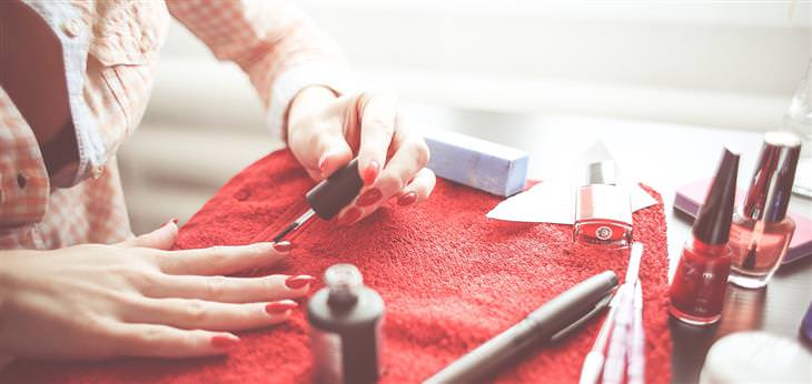 home toxins woman putting on nail polish