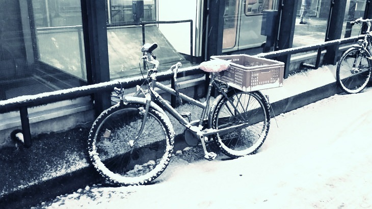 Helpful Winter Life Hacks On a Budget for dealing with Ice, Frost and Snow, bicycle covered in snow and ice