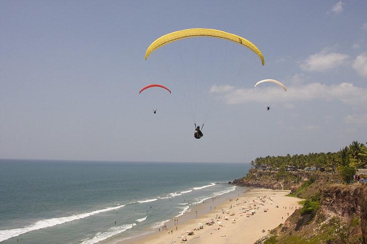 Sights and must-see destinations in the tourist state in India, Kerala, also known as God’s Own Country, Paragliding at Varkala Beach