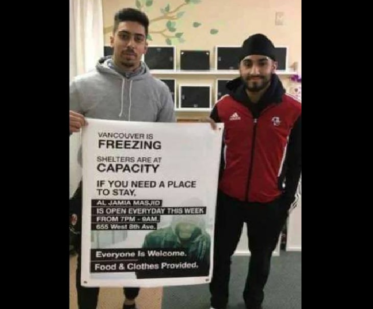 Wholesome and heartwarming pictures and stories, two men holding up a sign inviting people who need shelter to seek refuge in the mosque.