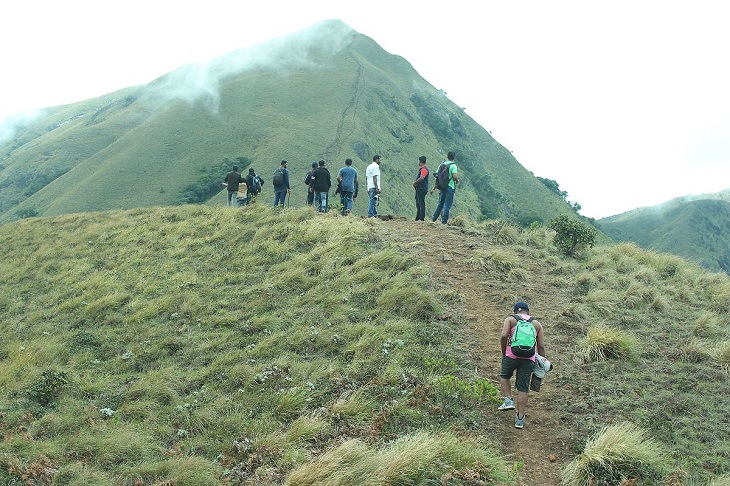 Sights and must-see destinations in the tourist state in India, Kerala, also known as God’s Own Country, Climbing Meesapulimala, the second highest peak of the Western Ghats located in the hill station Idukki