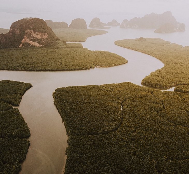 The sights, destinations and fun activities of cultural hub and land of beaches, Krabi in Thailand, The sun setting over the rivers and mangrove forests of Phang-nga National Park