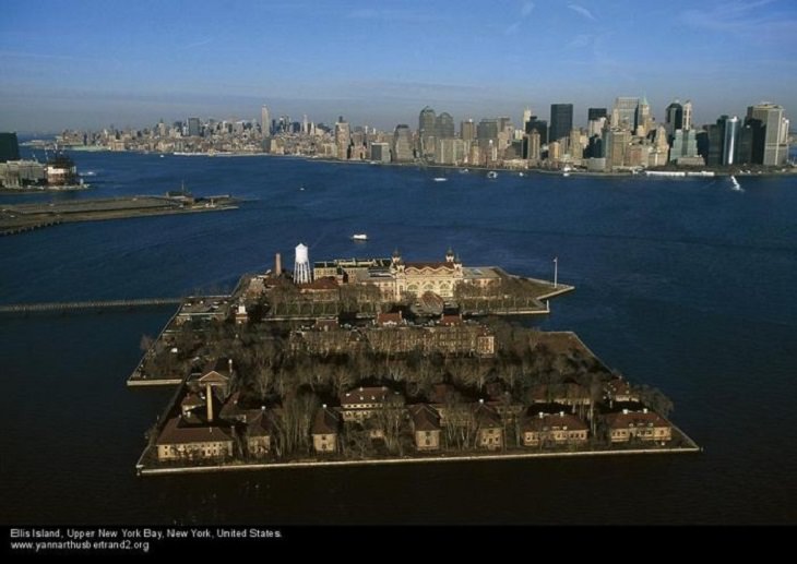 Aerial photos of New York City in “New York City From the Air” series by Yann Arthus-Bertrand, Ellis Island, Upper New York Bay