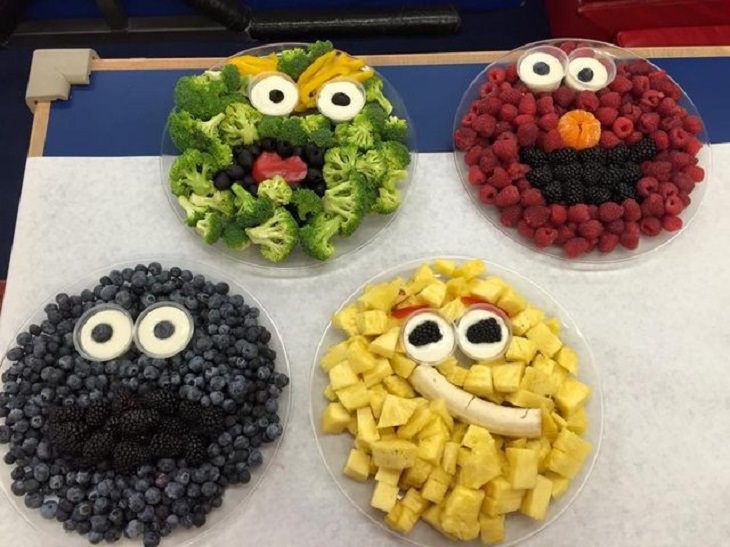 8 tips and tricks to help children develop healthy eating habits, Faces of elmo and other sesame street characters made out of bowls of fruit