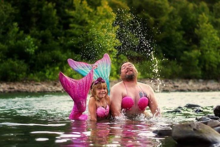 Clever and funny dads that win at parenting, Dad and daughter in water dressed as mermaids