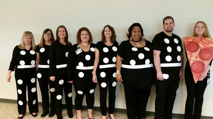 Hilarious and clever Halloween costumes based on puns and word play, People lined up dressed as dominoes and one dressed as a pizza
