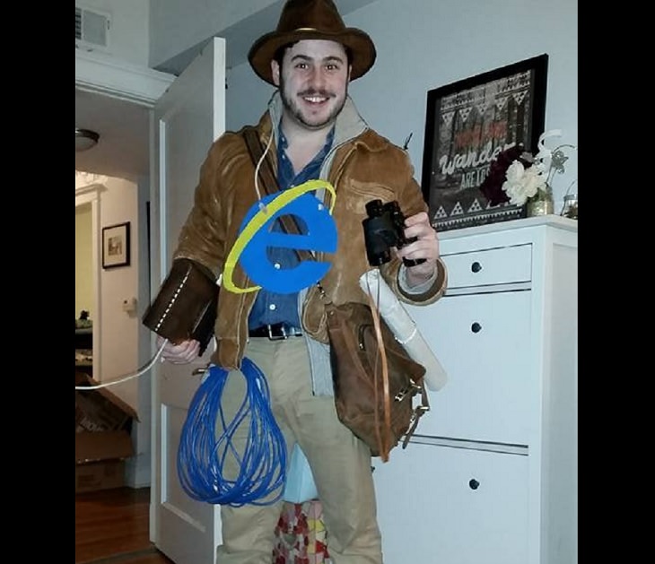 Hilarious and clever Halloween costumes based on puns and word play, Man dressed as an explorer with internet explorer sign on his chest