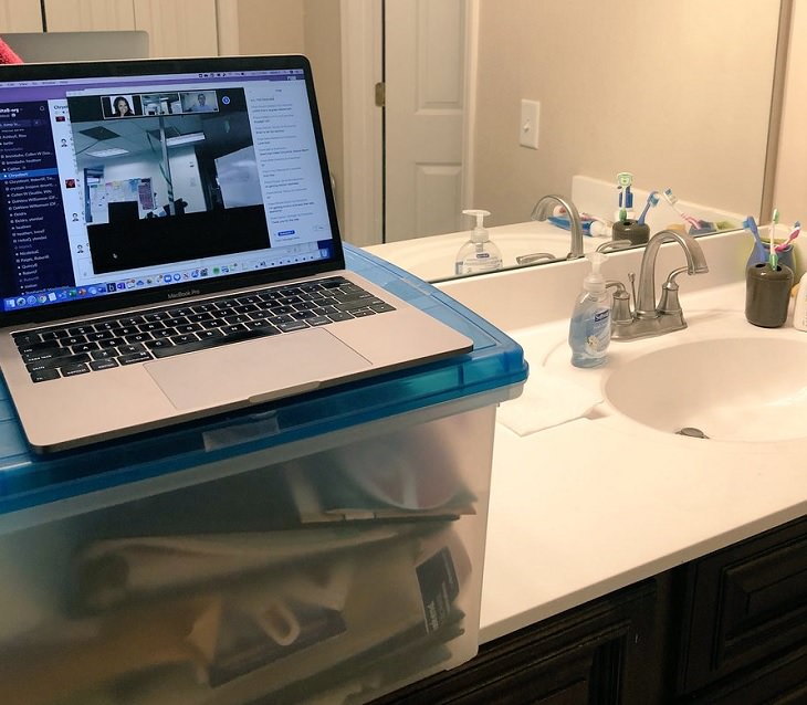 Funny improvised and makeshift work from home (wfh) workspaces and workstations, using bathroom counter as desk to work in the bathroom