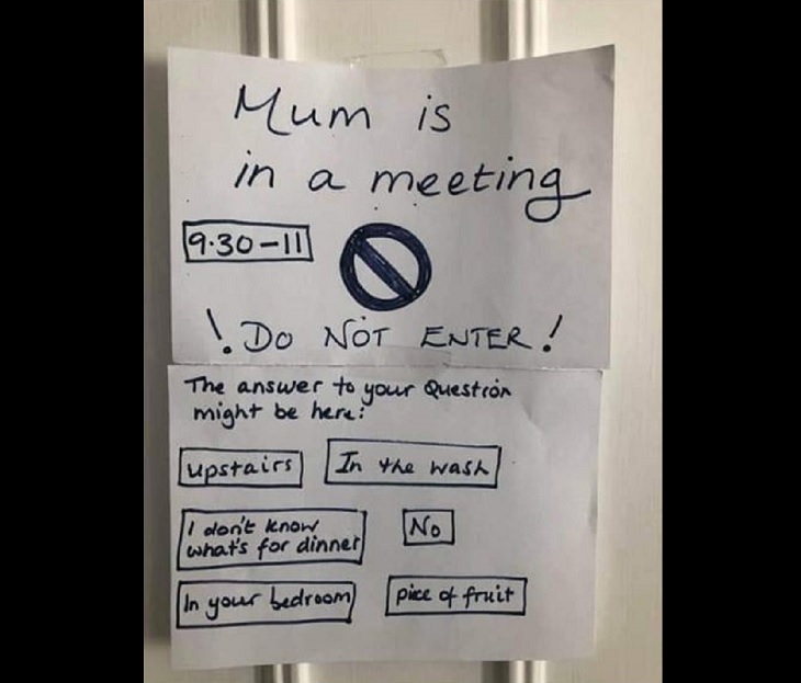 Funny signs related to the quarantine and lockdown caused by the COVID-19 (coronavirus) pandemic, paper sign on bedroom door saying “Mom is in a meeting” and listing answers to questions and instructions