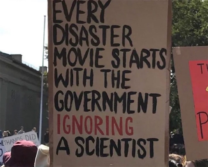 Funny signs related to the quarantine and lockdown caused by the COVID-19 (coronavirus) pandemic, sign saying “Every disaster movie starts with the government ignoring a scientist”