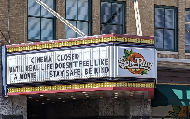 Funny signs related to the quarantine and lockdown caused by the COVID-19 (coronavirus) pandemic, Sun Ray cinema hall sign saying “Cinema closed until real life doesn’t feel like a movie. Stay safe. Be kind.”