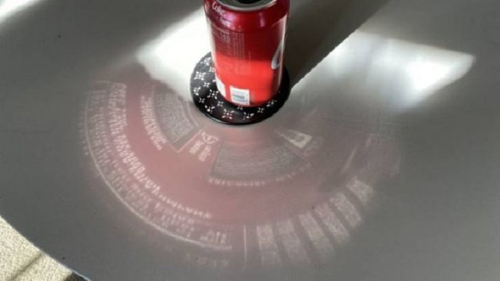 Photographs that will make you look twice or do a double take, Reflection of coke can