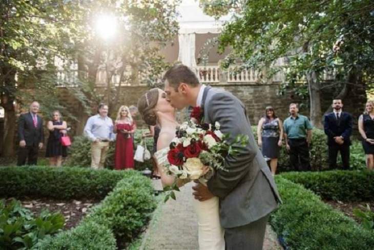 Photographs that will make you look twice or do a double take, Bride and groom kissing